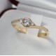 Złoty pierścionek z białym szafirem i brylantami